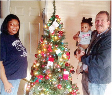 Wheeless,  CRDC deliver  Christmas tree to family